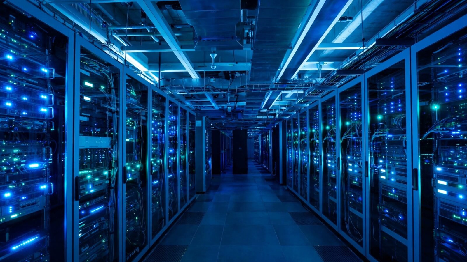 Rows of server racks with blinking lights inside a data center