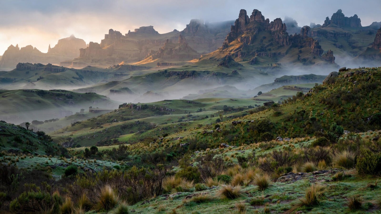 Misty highland mountains and green hills in northern Ethiopia at dawn.