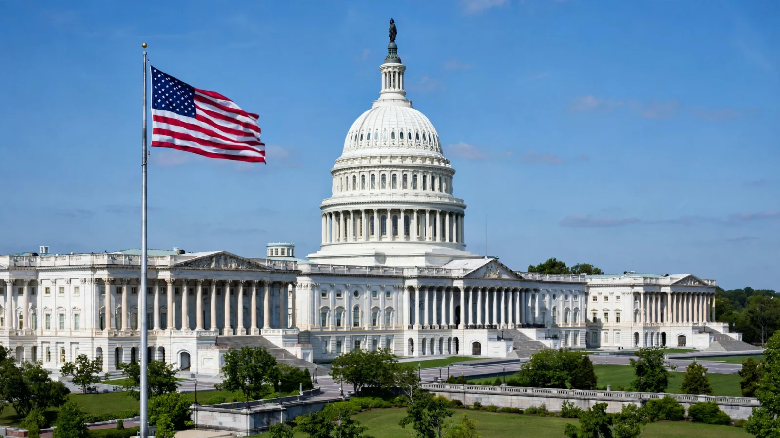 The U.S. Capitol building in Washington, D.C., with an American flag flying on a clear day