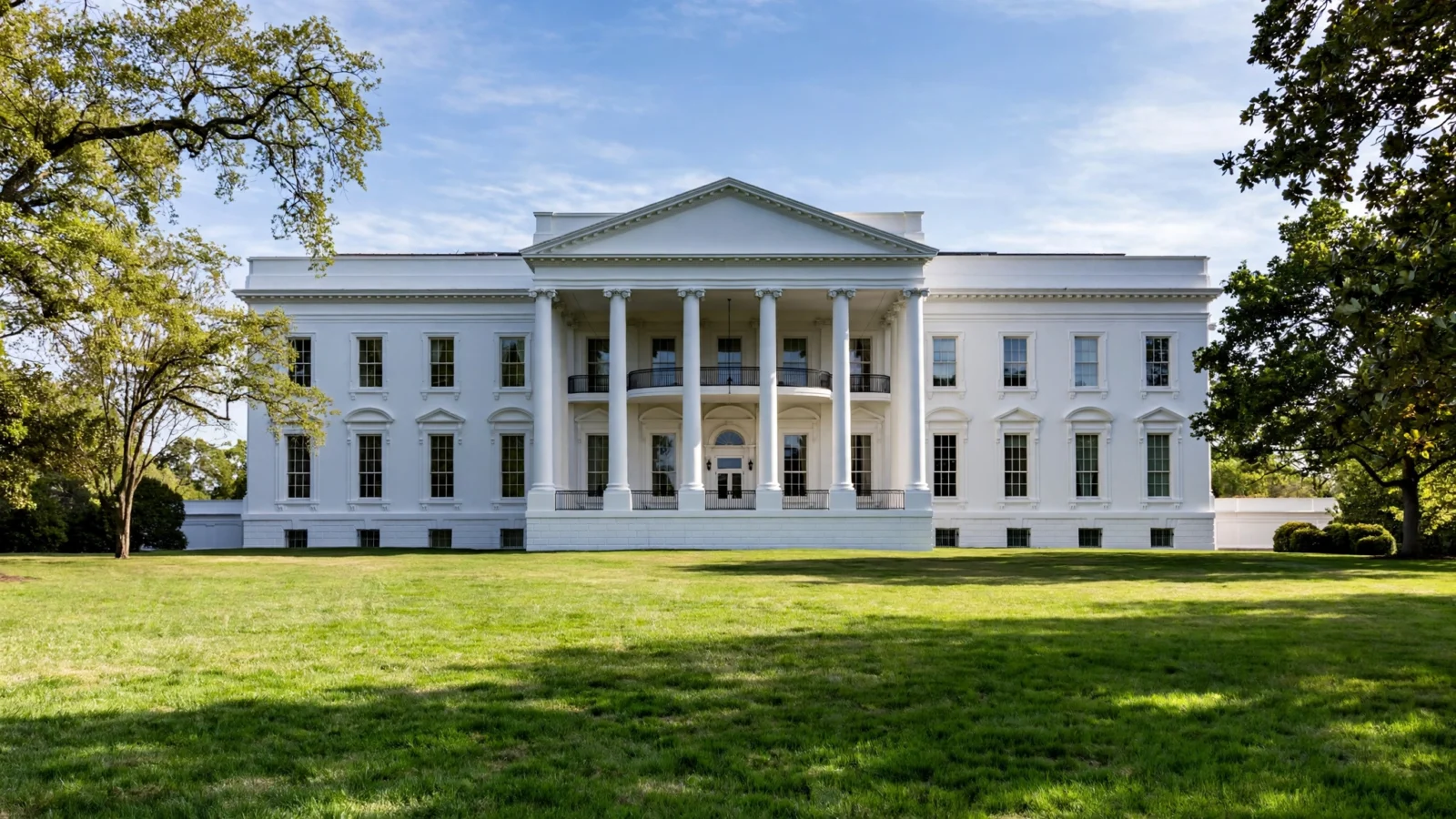 The White House north facade on a clear day with blue sky and front lawn