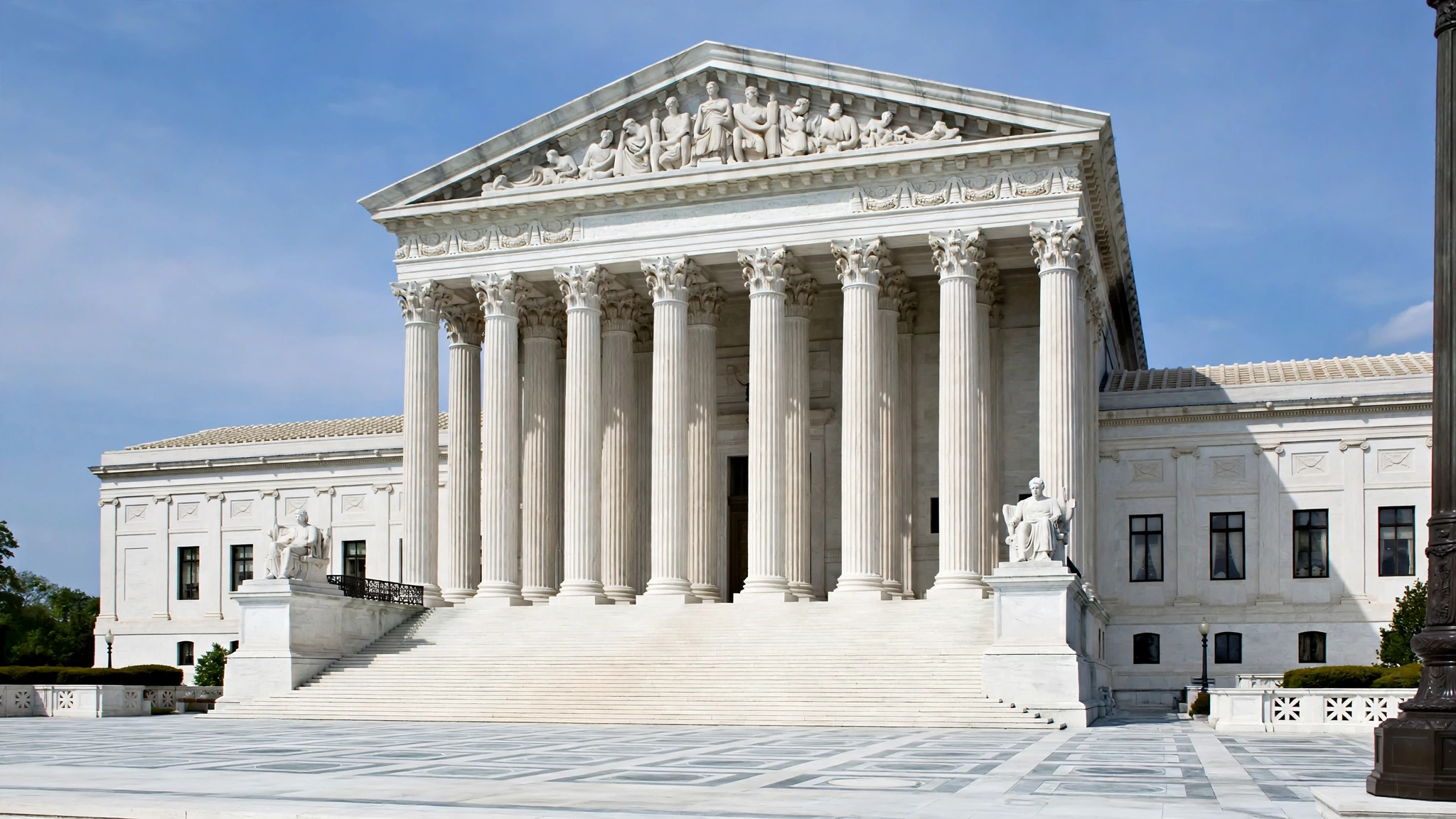 The white marble facade and tall columns of the United States Supreme Court building in Washington