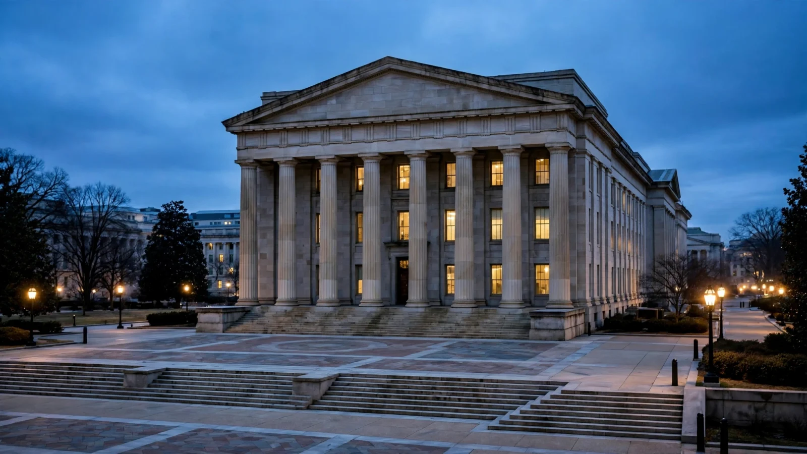 A stone government building with tall columns and lighted windows at dusk in Washington