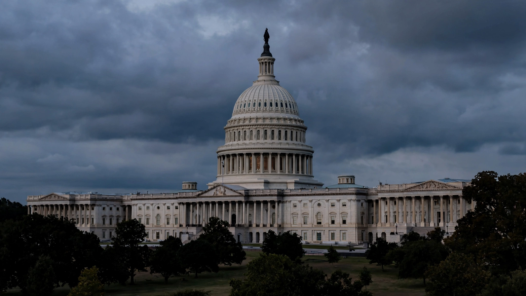 The dome of the US Capitol building in Washington under a cloudy sky at dusk