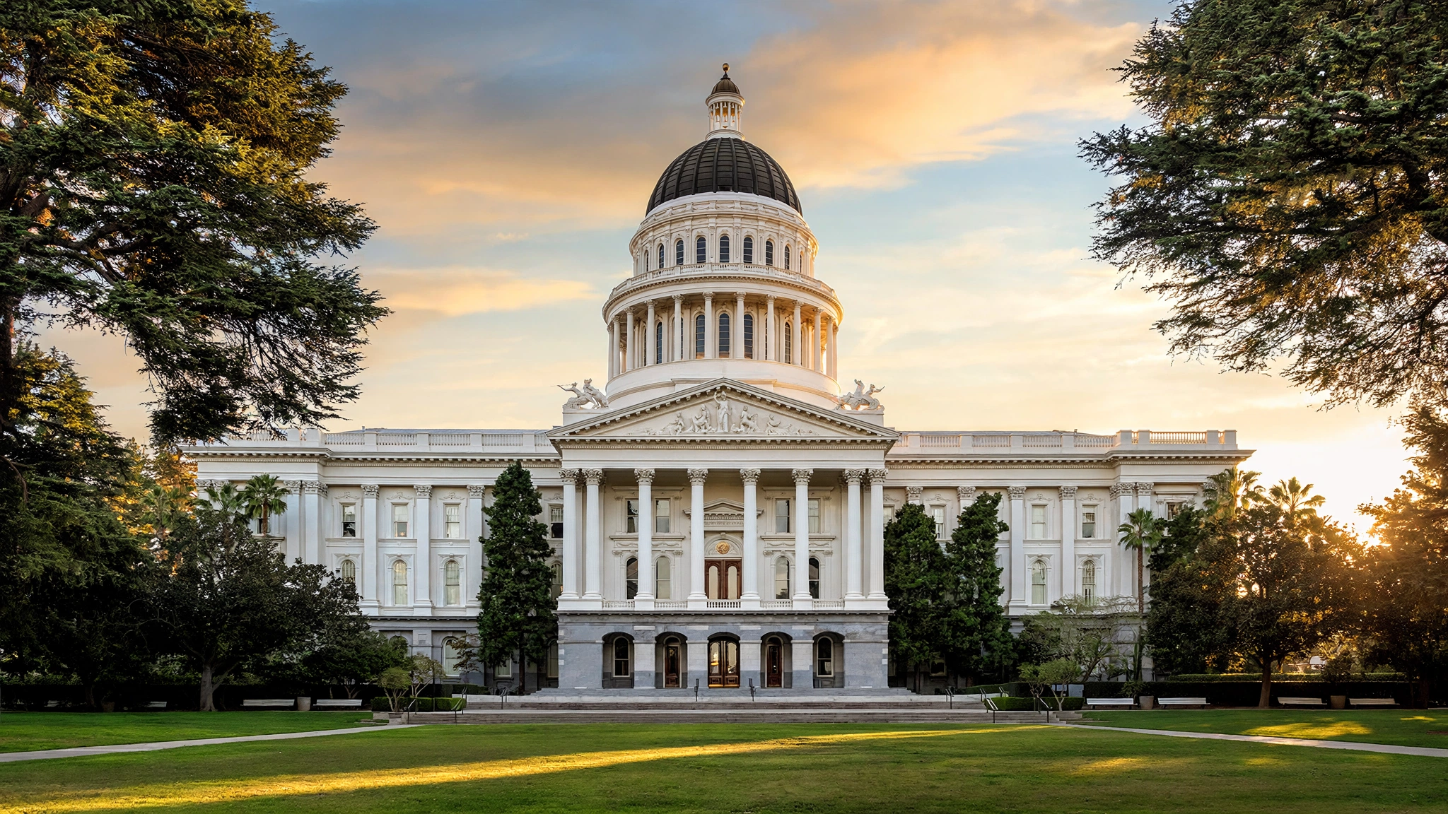 The California State Capitol building in Sacramento with its white dome at golden hour