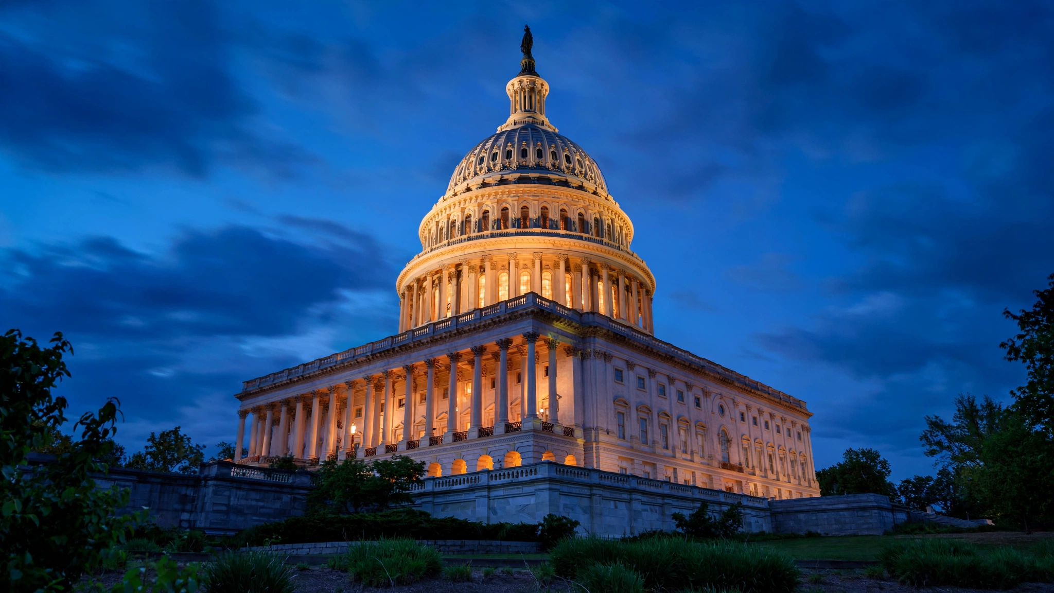 The dome of the U.S. Capitol building lit at dusk.