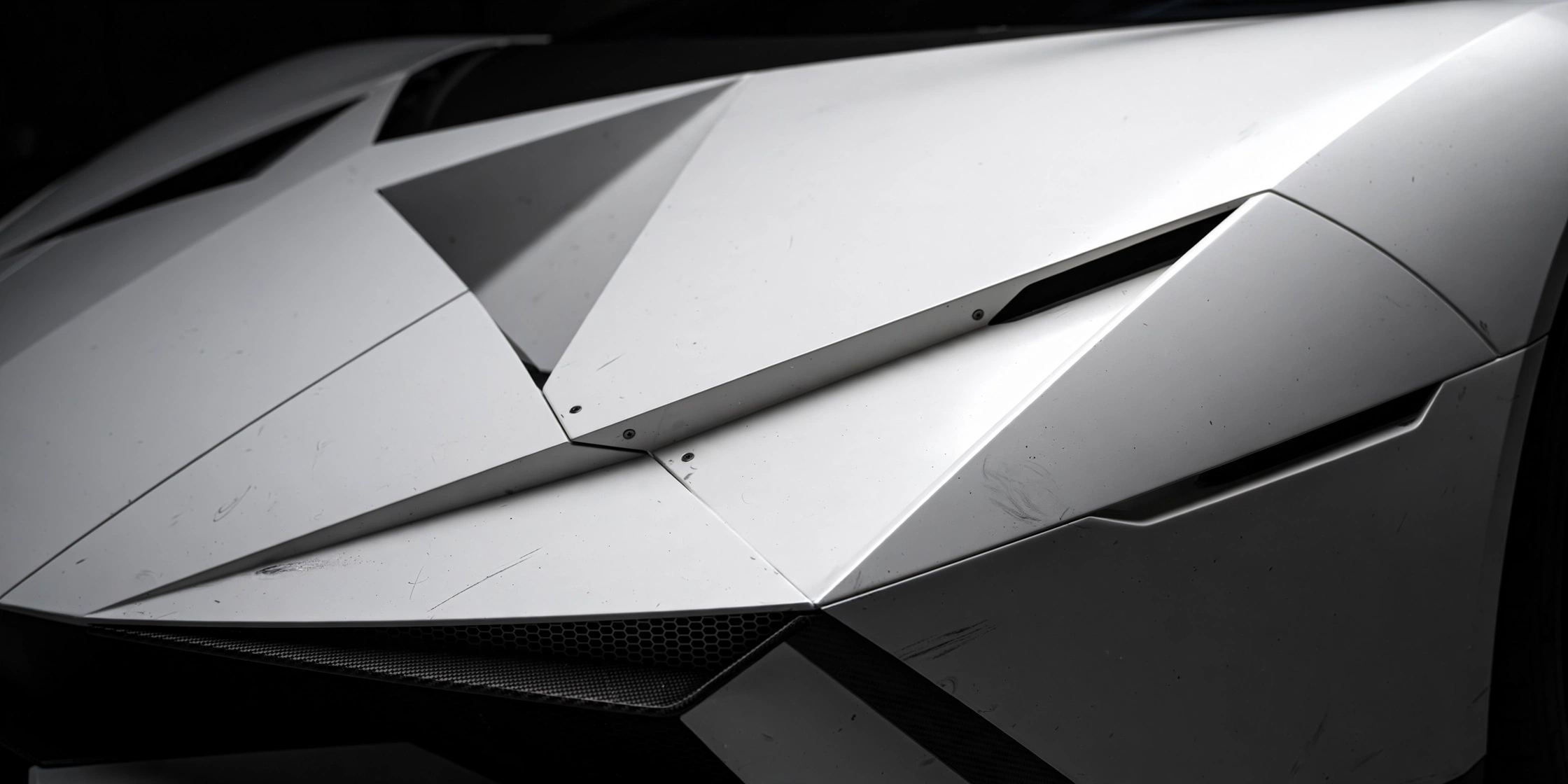 Close-up of a futuristic angular white sports car body panel with sharp geometric lines under dramatic studio lighting