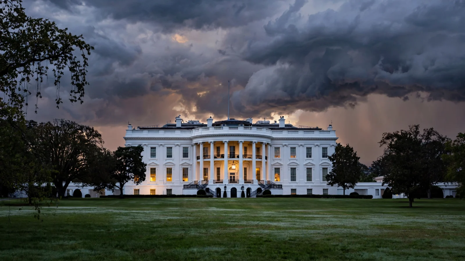 The White House seen from the South Lawn at dusk under a cloudy sky