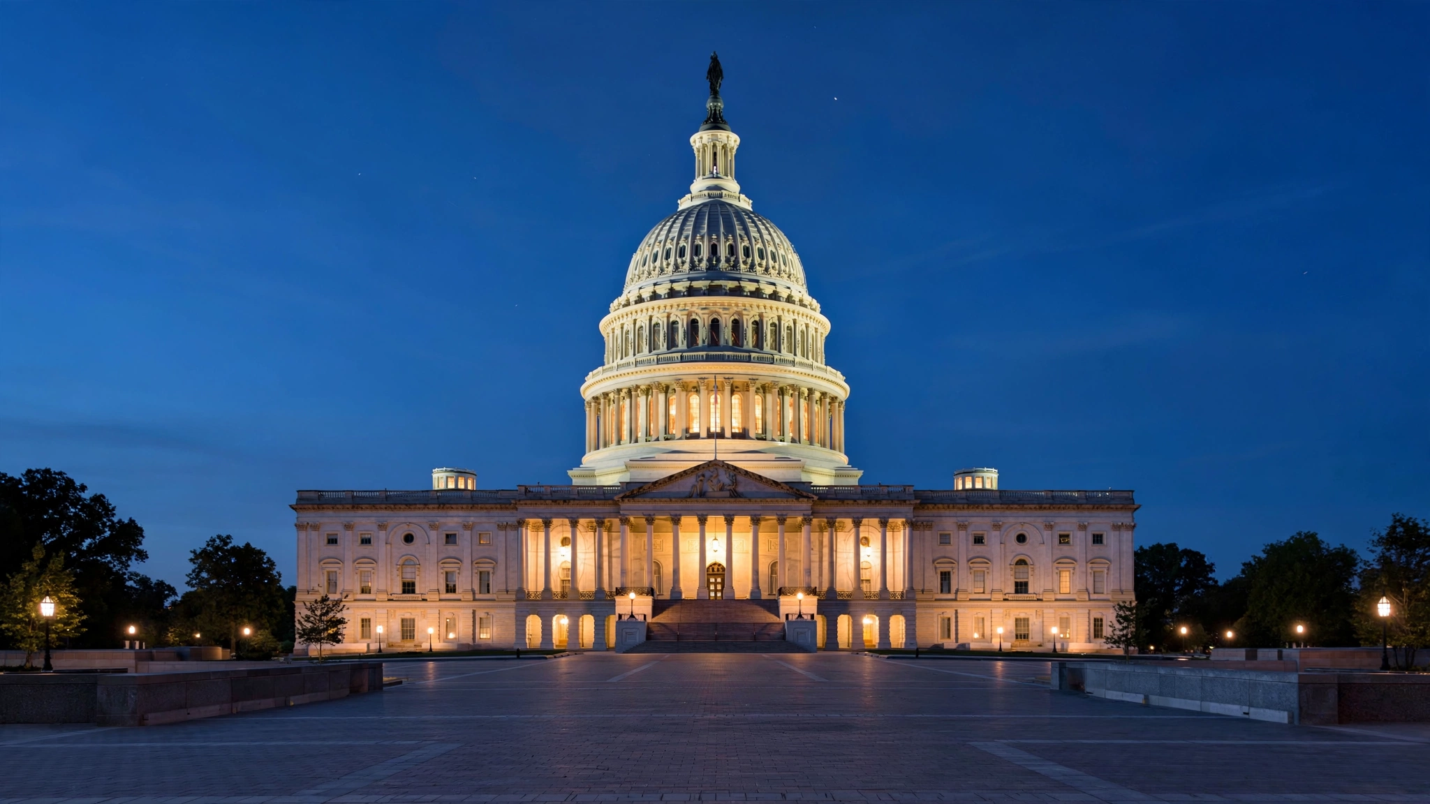 The United States Capitol building lit up at dusk in Washington, D.C.