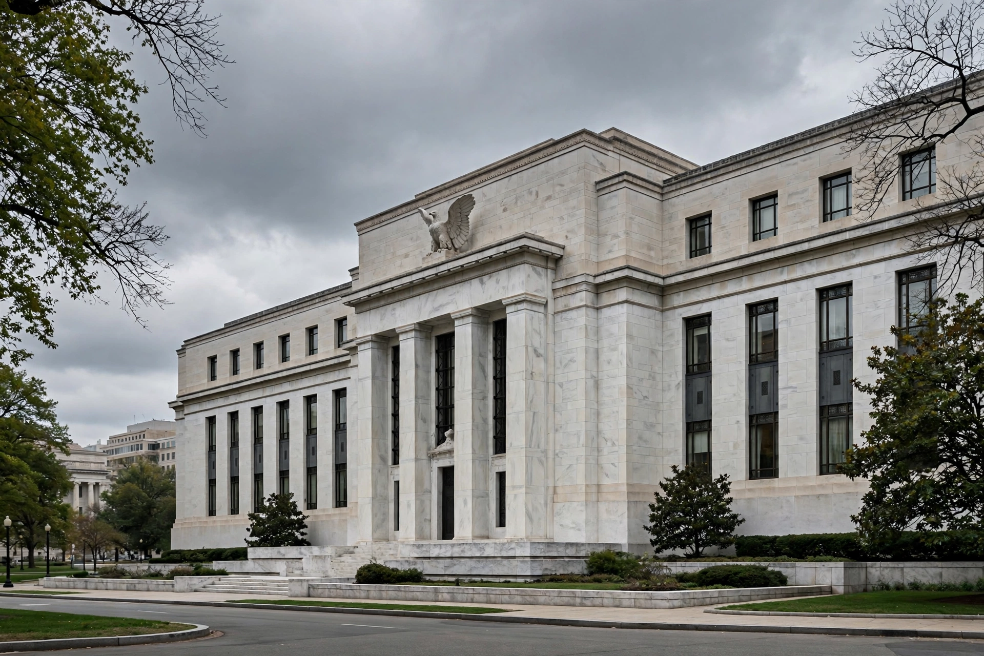 Marble neoclassical facade of the Federal Reserve building in Washington DC under cloudy skies